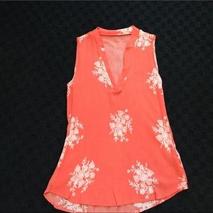 Sleeveless tangerine/cream colored sleeveless top